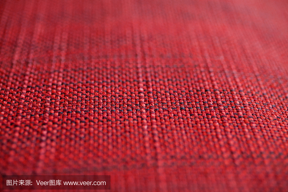 红色织物纹理。红色的背景布。红色织物的纹理和背景的近视图。抽象的背景和纹理为设计师。